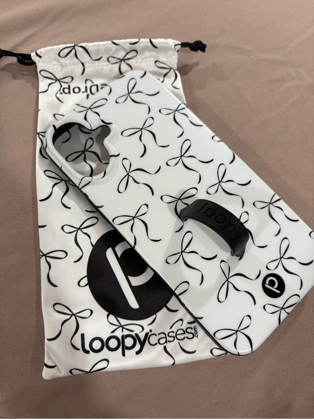 iPhone 16 plus Loopy Phone Case - White with Black Bow Design